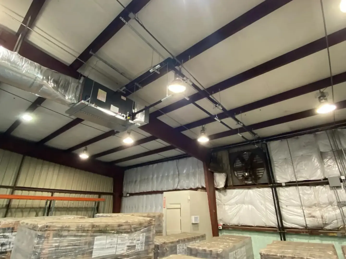 Insulated walls and ceiling of a commercial warehouse
