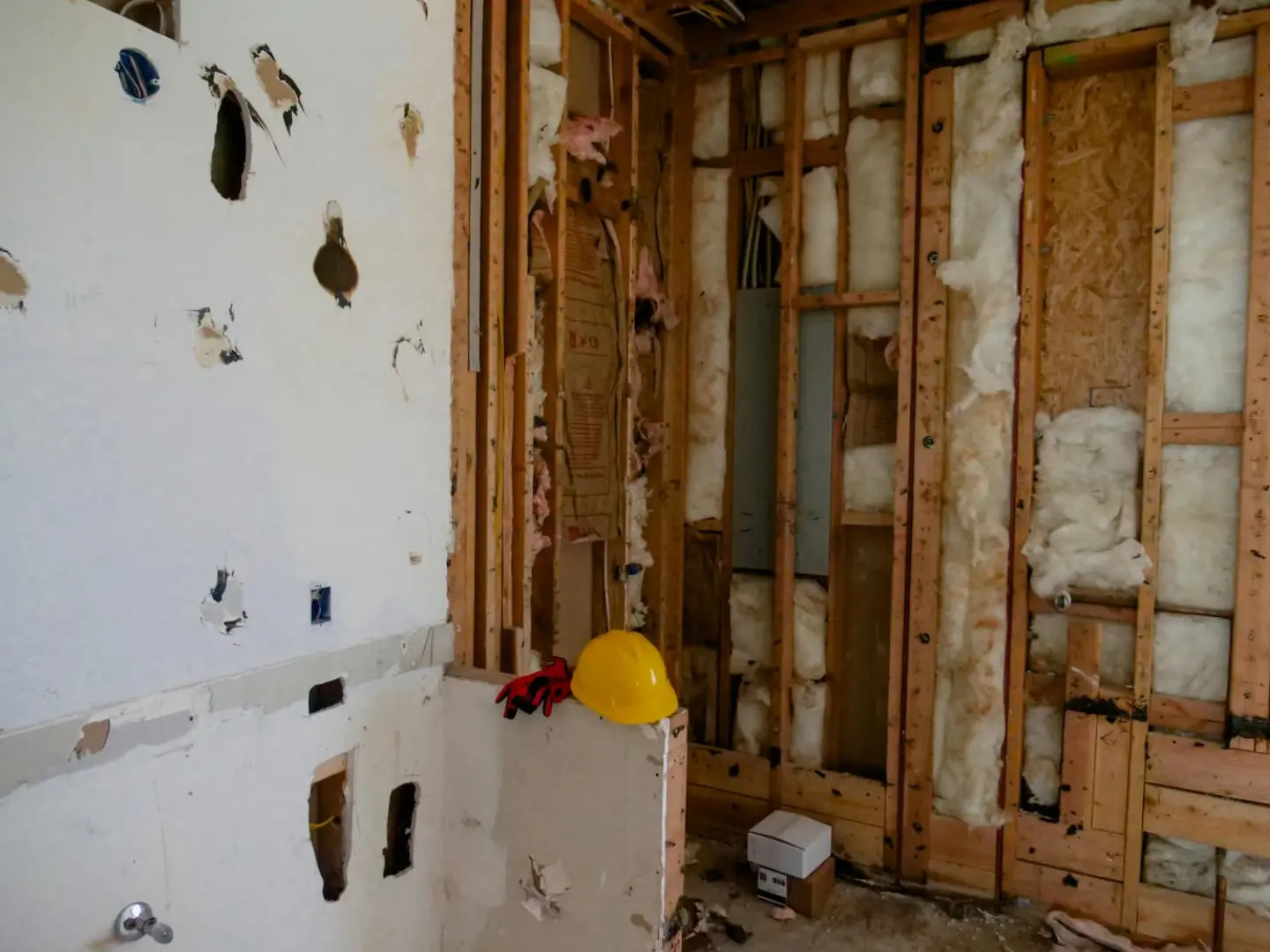 Open wall cavities with batt insulation during a home renovation